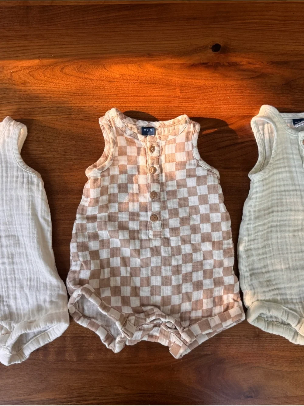 Old Navy Muslin Baby Rompers in Cream, Light Green Stripes, and Taupe Checkers